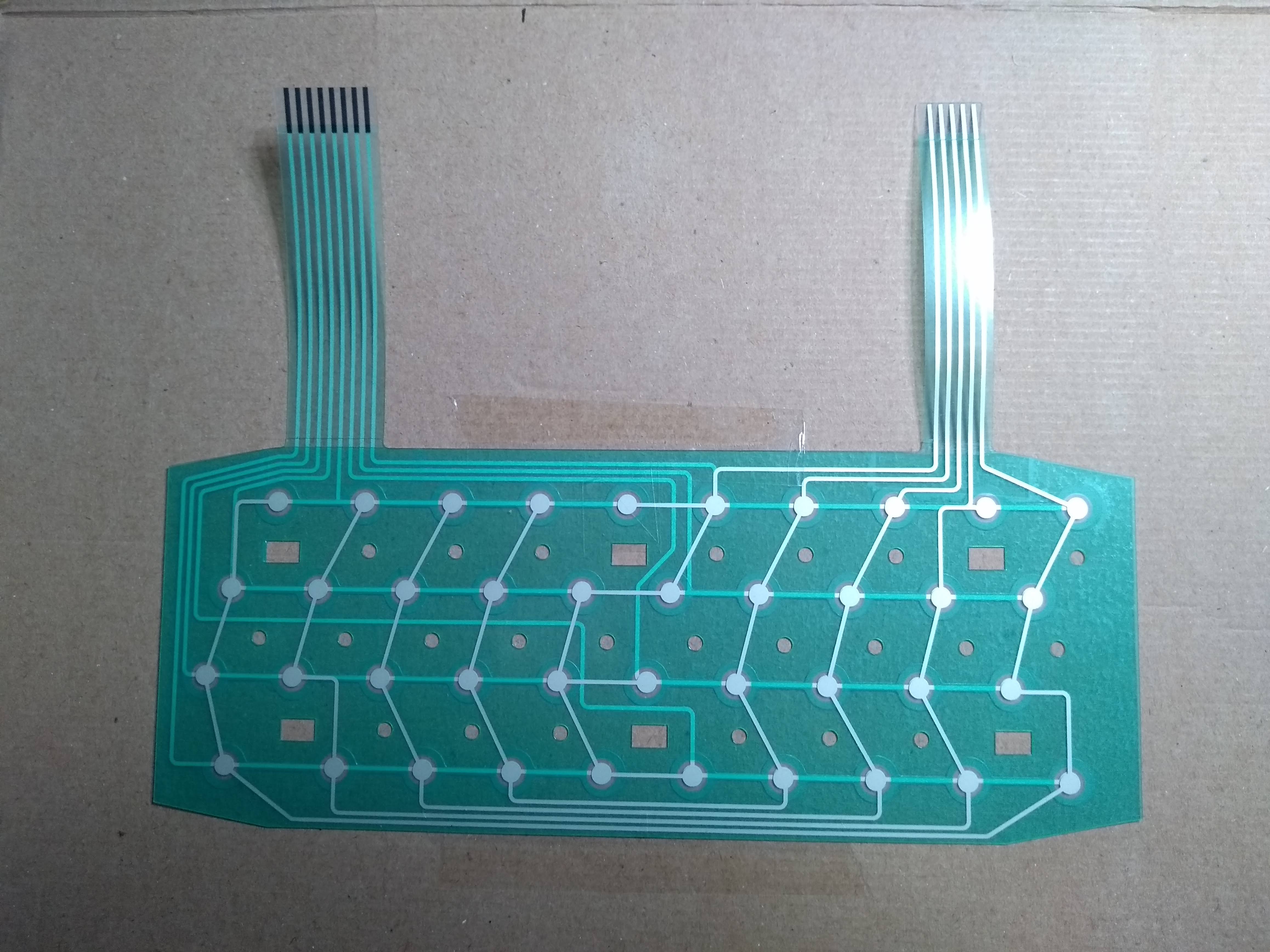 ZX Spectrum computer keyboard membrane; between two thing sheets of flexible plastic are all the metal connectors you need to make a flat 40-key keyboard. Quite delicate